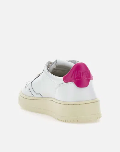 Shop Autry Sneakers In White/fuchsia