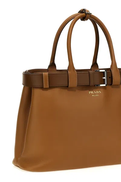 Shop Prada Women ' Buckle' Large Handbag In Brown