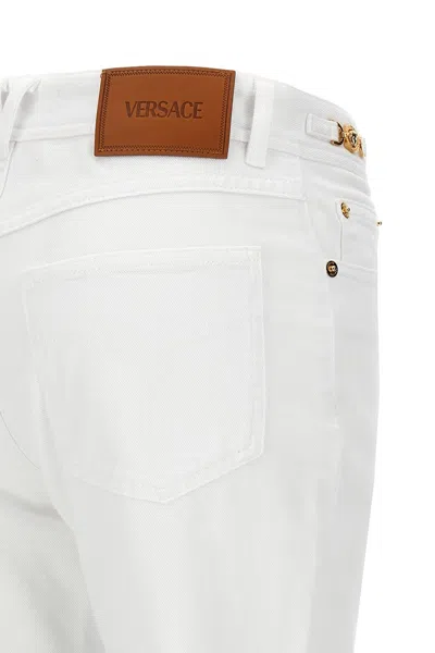 Shop Versace Women Flared Jeans In White