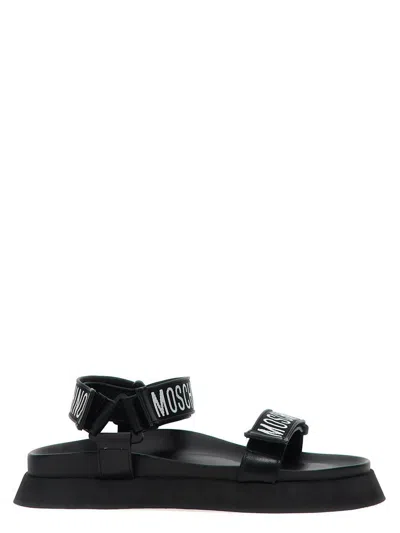 Shop Moschino 'fussbet' Sandals In White/black