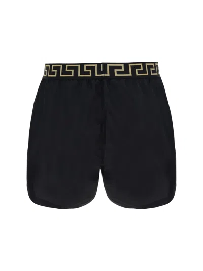 Shop Versace Black Swimsuit Shorts With Greca Detail In Tech Fabric Man