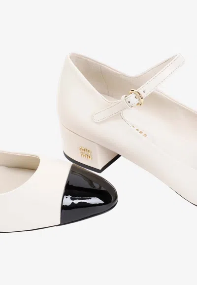 Shop Miu Miu 35 Leather Pumps In Ivory