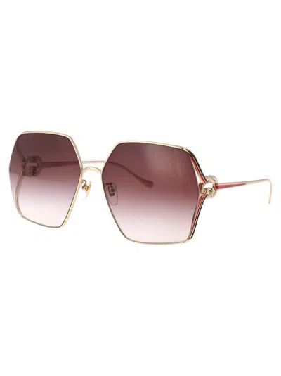 Shop Gucci Eyewear Sunglasses In Gold