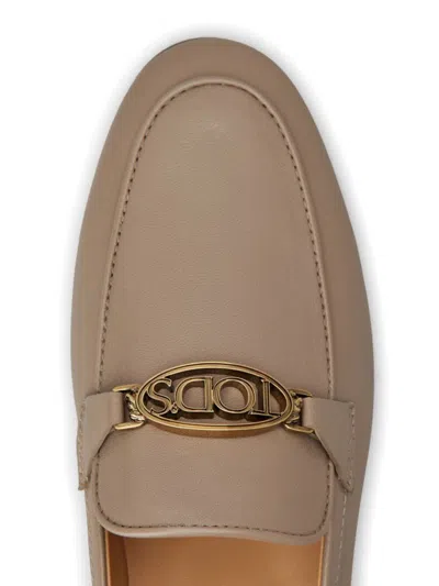 Tod's Classic Logo Plaque Leather Loafers For Women In Nude & Neutrals