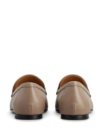Tod's Classic Logo Plaque Leather Loafers For Women In Nude & Neutrals