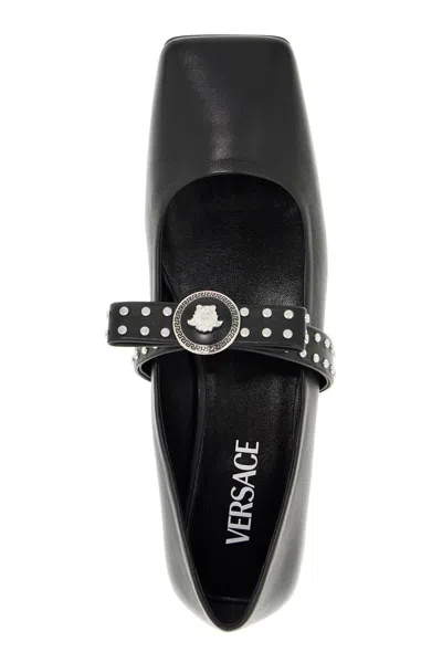 Shop Versace Gianni Ribbon Studded Baller In Black