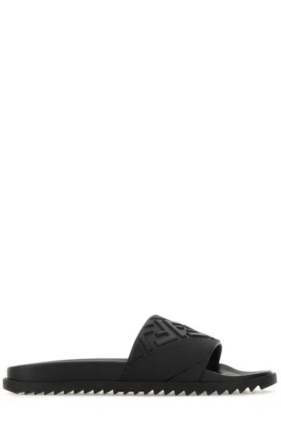 Shop Fendi Logo Embossed Slip-on Slippers In Nero