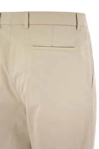 Shop Brunello Cucinelli Garment-dyed Leisure Fit Trousers In American Pima Comfort Cotton With Pleats In Beige