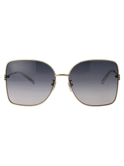 Shop Gucci Sunglasses In 002 Gold Gold Grey