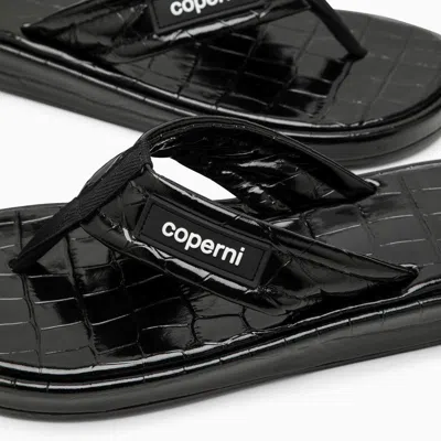 Coperni Logo-appliquéd Rubber-trimmed Croc-effect Patent Leather Flip Flops In Black