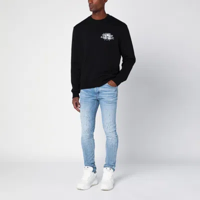 Shop Amiri Light Blue Washed Skinny Jeans With Wear