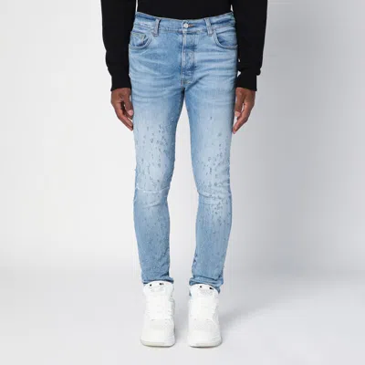 Shop Amiri Light Washed Skinny Jeans With Wear In Blue