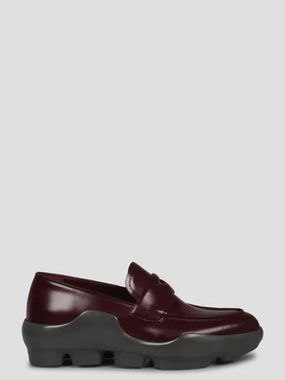 Shop Prada Spazzolato Leather Loafers In Red