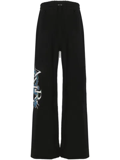 Shop Amiri Trousers In Black