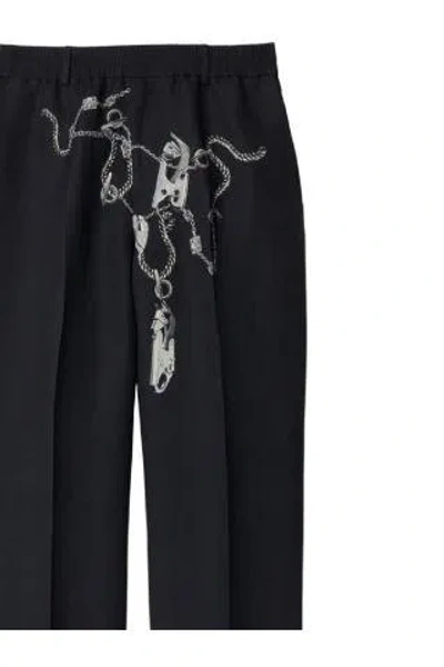 Shop Burberry Trousers In Silver/black