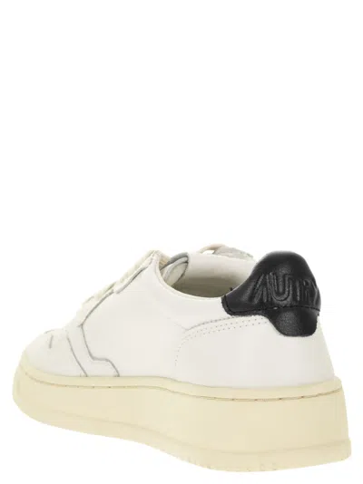 Autry Medalist Low Sneakers In White And Navy Blue Leather