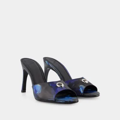 Shop Coperni Holographic Logo Mules In Black
