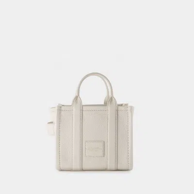 Shop Marc Jacobs The Mini Crossbody Tote In Beige