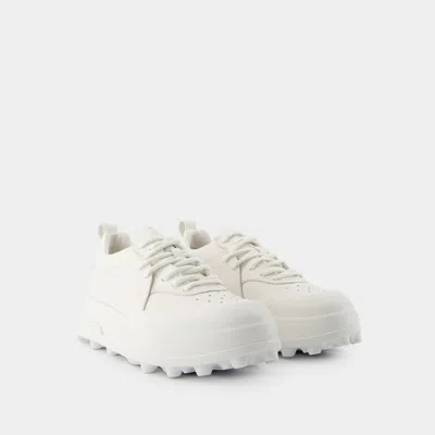 Jil Sander Orb White Low Top Sneakers With Cleated Sole In Leather In White