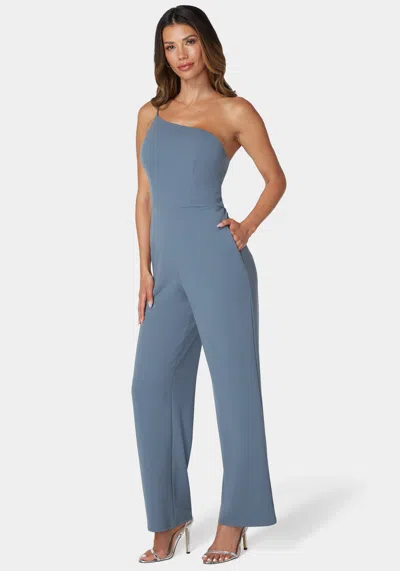 Shop Bebe One Shoulder Core Jumpsuit In Denim