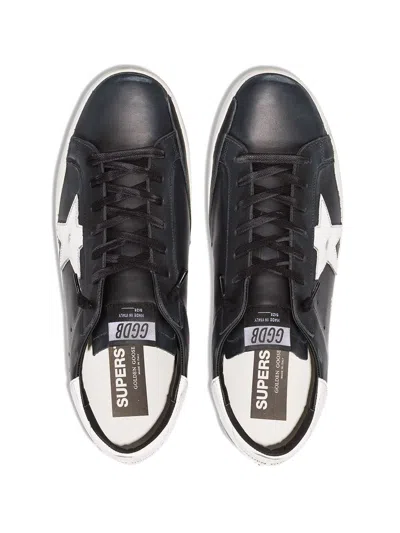 Golden Goose 'super-star' Black Low Top Sneakers With Logo Patch And Suede Details In Leather Man
