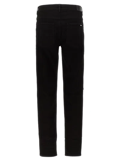 Amiri Slim Fit Distressed Trousers With Rivet Detailing