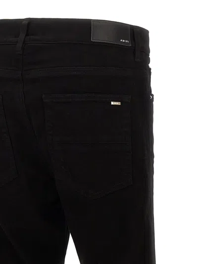 Amiri Slim Fit Distressed Trousers With Rivet Detailing