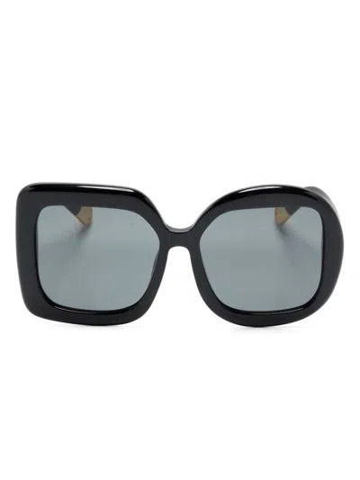 Shop Jacquemus Oversized Asymmetric Sunglasses In Black