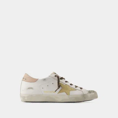 Shop Golden Goose Super Star Sneakers In White