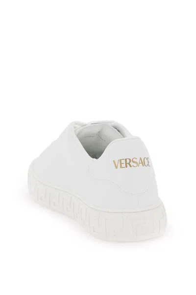 Shop Versace Greca Sneakers In White