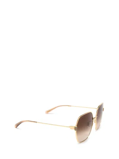 Shop Gucci Eyewear Sunglasses In Gold