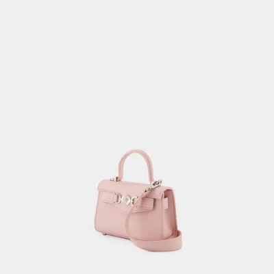 Shop Versace Mini Medusa 95 Crossbody In Pink