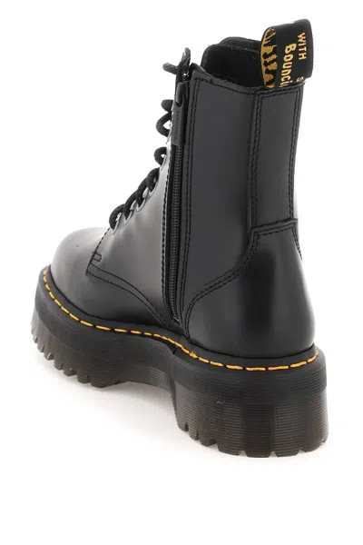 Dr. Martens' Platform Boots With Treaded Sole And Distinctive Accents In Black