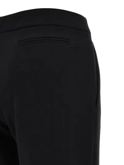 Moschino Flared High Waist Trousers With Front Crease In Black