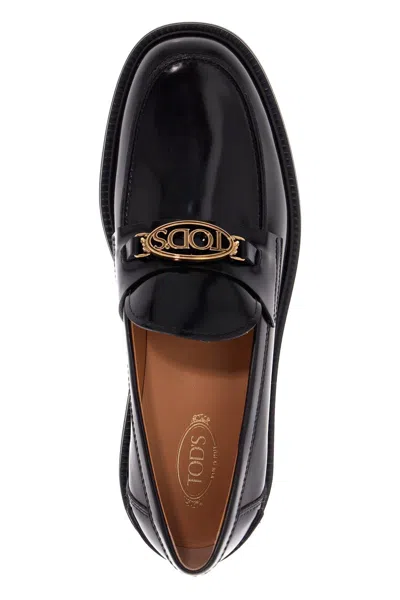 Shop Tod's Metal Logo Loafers With Metal Detailing In Black