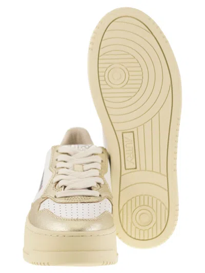 Autry Platform Low-top Sneakers With Platform Sole In Gold
