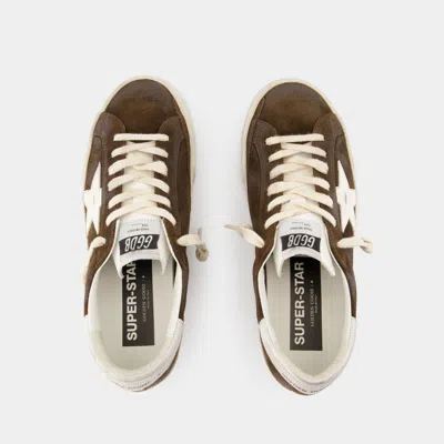 Shop Golden Goose Super Star Sneakers In Brown