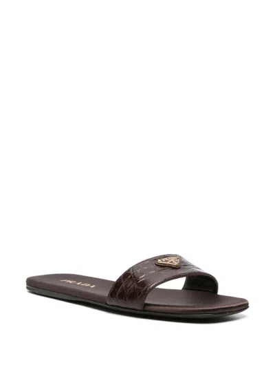 Shop Prada Triangle-logo Embossed-crocodile Slides In Brown