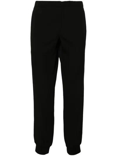 Shop Prada Drawstring-waist Tapered Trousers In Black