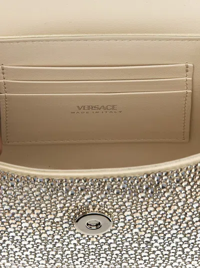 Shop Versace 'medusa' Mini Handbag In 浅褐色的