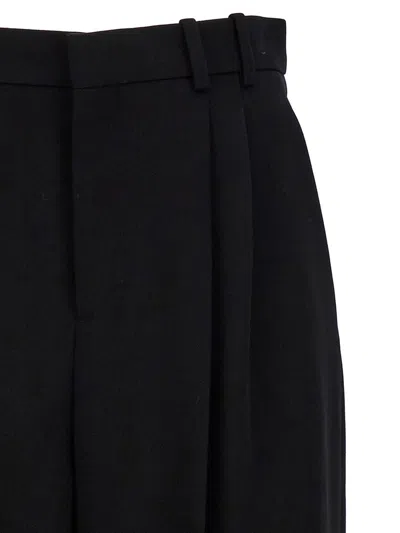 Shop Saint Laurent Wool Wide-leg Trousers In Black