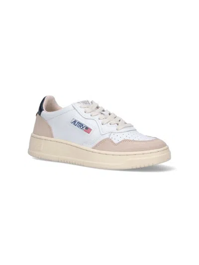 Shop Autry Sneakers In White