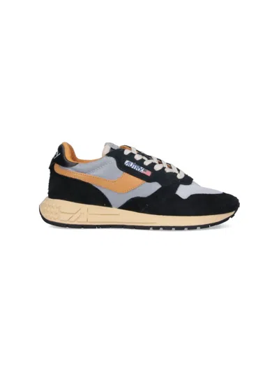 Autry Low Sneaker With Contrast Stitching And Mesh Panels In Black