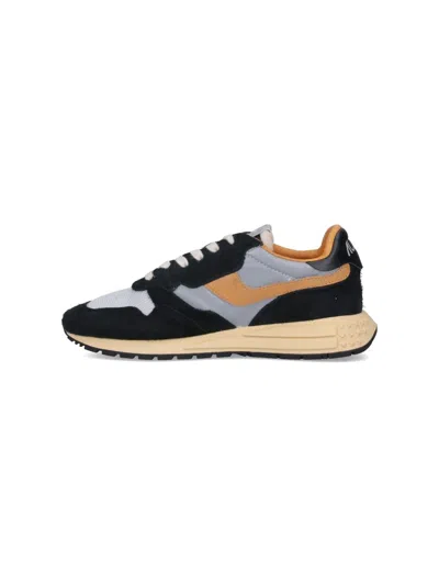 Autry Low Sneaker With Contrast Stitching And Mesh Panels In Black