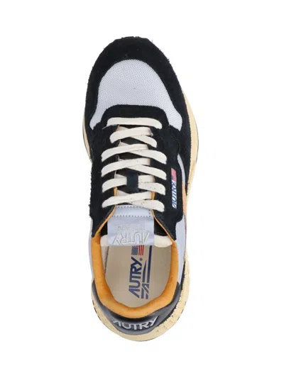 Autry Low Sneaker With Contrast Stitching And Mesh Panels In Black