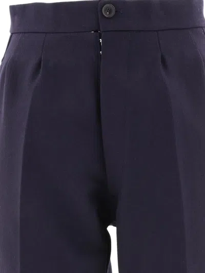 Shop Maison Margiela Herringbone Wool Pleated Trousers In Black