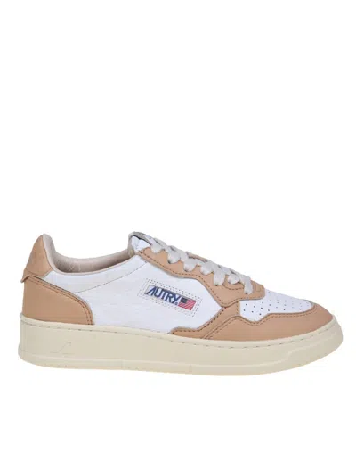 Shop Autry Leather Sneakers In White/caramel