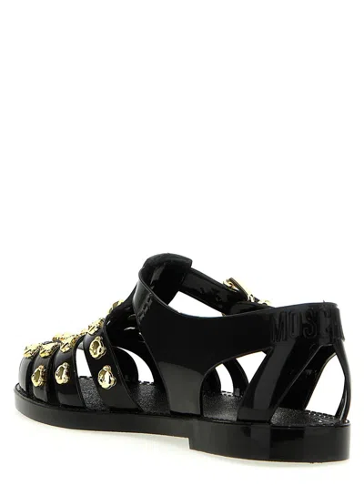 Shop Moschino Jelly Sandals In Black