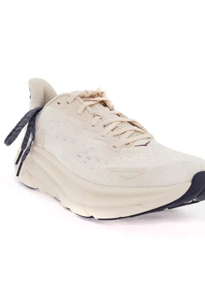 Shop Hoka Clifton 9 Sneakers In White