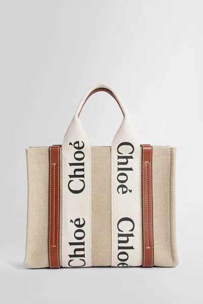 Chloé Structured White Handbag With Bold Branding In Beige